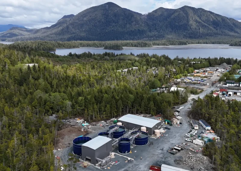 A view of Greatario's Wastewater storage tanks in Tofino, British Columbia with scenic mountains in the background.